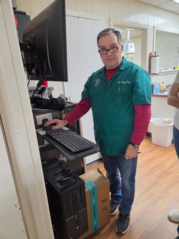 carousal-img5 Dr. Charles Hayes working on a computer